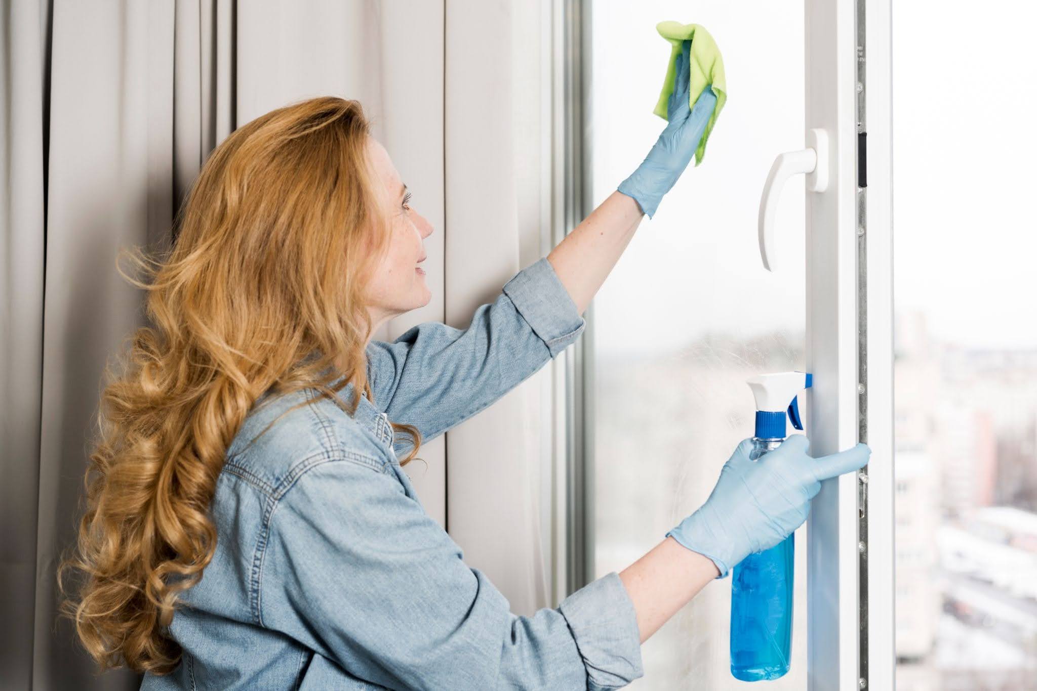 A woman cleaning windows. 